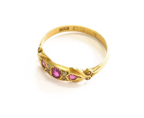 An 18 Carat Gold Ruby and Diamond Five Stone Ring, finger size QGross weight 2.7 grams.