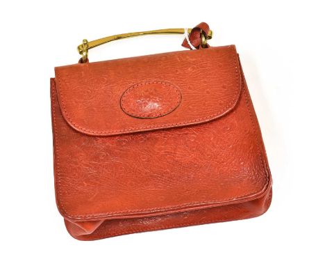 Circa 1980-90s Mulberry Red Ostrich Leather Handbag, with brass hinged handle, open pocket to the reverse, gold tone hardware