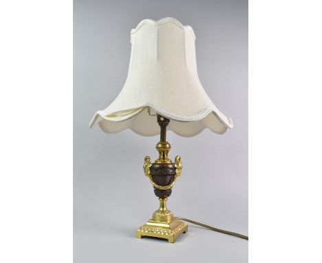 A Modern Bronze and Gilt Brass Table Lamp and Shade with Rams Head Mounts in the French Second Empire Style, 47cms High