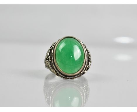 A Jade Type Stone Oval Cabochon Ring Having Bamboo and Dragon Decoration to Shoulders, Unmarked White Metal, size T.5