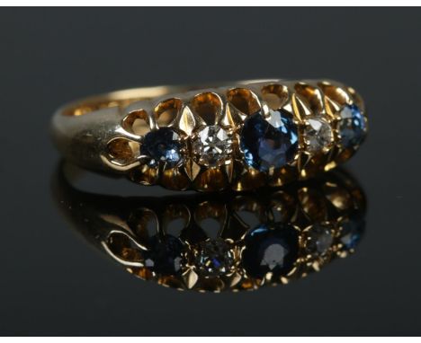 An early 20th century 18ct gold sapphire and diamond five stone ring. Size K. 2.97g.  