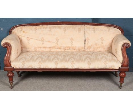 A Victorian carved mahogany upholstered parlour sofa. (95cm x 190cm x 62cm)  In need of restoration.