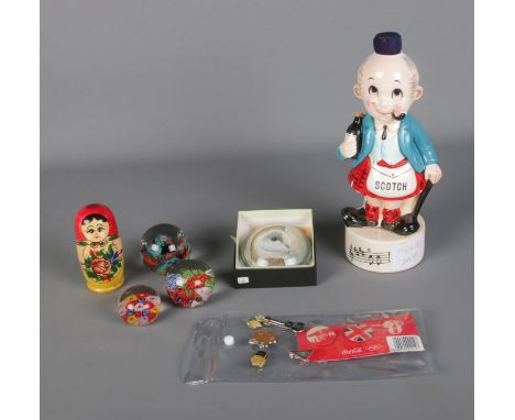 A quantity of collectables to include glass paperweights, Scotch musical decanter, Russian doll and small quantity of pin bad