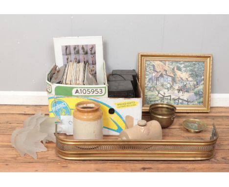 A box of assorted items, to include a collection of easy listening records, brass fire fender, frosted glass light fittings, 