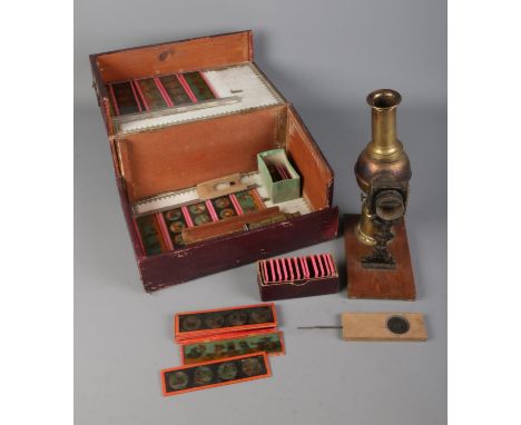 A Victorian brass Lantern Magica magic lantern along with collection of coloured slides in original faux leather pine box.  