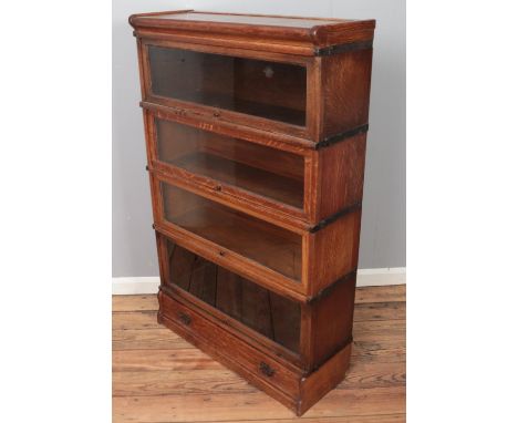 An oak Globe Wernicke four section stacking bookcase. (137cm x 86cm)  