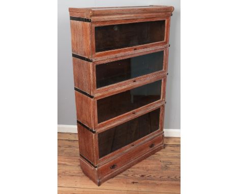 An oak Globe Wernicke four section stacking bookcase. (142cm x 86cm)  