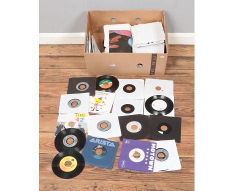 A box of assorted vinyl single records of mainly pop and rock featuring several black label, jukebox only singles and two whi