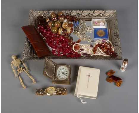 A gilt framed dressing table tray with contents of costume jewellery and collectables. To include Europa travel clock, Limoge