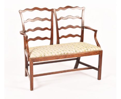 19th cent mahogany Chippendale design love seat with twin ladder backs, open arms and drop in seat, likely converted from two