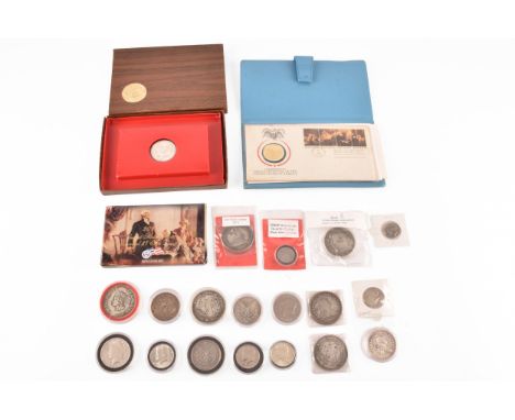 A collection of US coinage, including four Liberty half dollar coins, 1964, 1967, 1969 and 2016, two Liberty one dollar coins