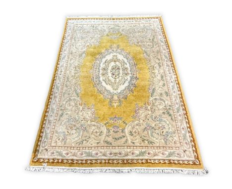 A large yellow ground floor carpet, with floral decoration, 373cm x 280 cm.