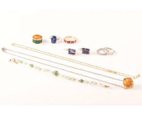 A collection of silver jewellery, including a pair of silver cubic zirconia hoops earrings, a silver amber cube necklace, a s