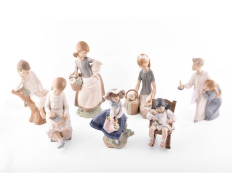 A group of Lladro figures, including a young girl holding a basket of flowers, a little girl sleeping with her doll, a little