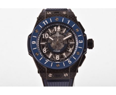 A Hublot Big Bang Unico GMT carbon fibre blue ceramic wristwatch, the blue skeleton dial with, self-winding chronograph flyba