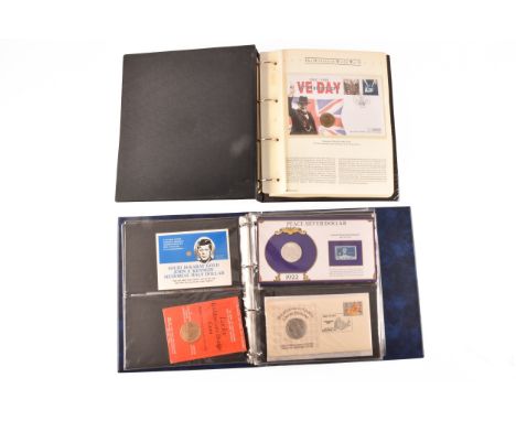 Two albums of coin first day covers, including a Henry VIII 24ct gold limited edition coin, a 14ct gold John F. Kennedy memor