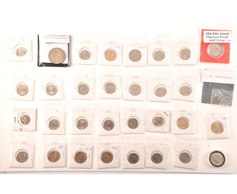 American Coins. A collection of coins including an 1896 silver dollar, an 1891 silver dime, an Ellis Island 1984 titanium pro