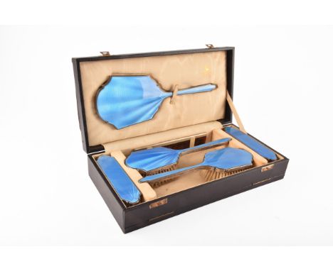 A George V silver and blue enamel dressing table boxed set, hallmarked for Birmingham 1931 by Goldsmiths &amp; Silversmiths C
