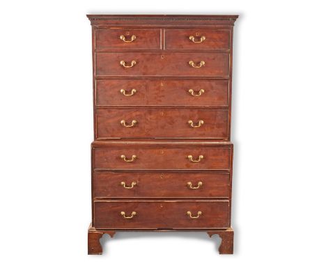 A George III mahogany chest on chest/tall boy with dentil cornice, the top with two short and three long graduated drawers, u