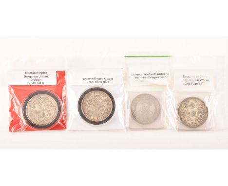 A group of four Chinese silver coins including a Republic of China Pingjiang Su Wei Ai One Yuan 1931 coin, a Chinese Tibetan 
