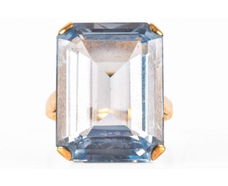 A 9ct yellow gold synthetic blue spinel ring, set with a step cut sythetic blue spinel, size L 1/2. Partially worn hallmarks 