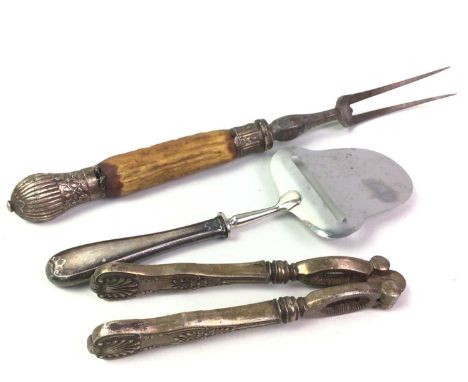 SILVER HANDLED CARVING FORK, AND OTHER ITEMS  including nut crackers, cake slice, trophy, glass bowl and coins