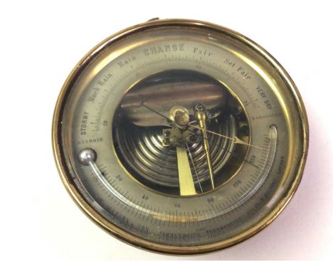 BRASS BAROMETER, W.W. WATSON & SON of shaped circular form, maker name to face