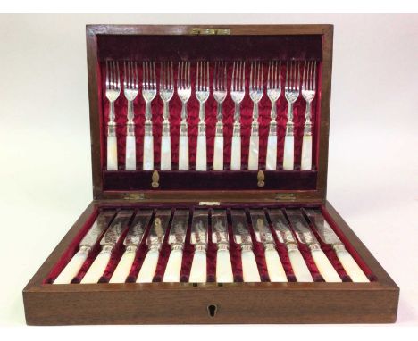 WALKER & HALL SUITE OF SILVER PLATED CUTLERY, comprising forks and knives, with mother of pearl handles, housed in an oak cas
