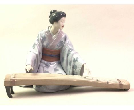 GROUP OF LLADRO FIGURES,  comprising a lady seated playing an instrument, numbered 8223, another female figure playing an ins