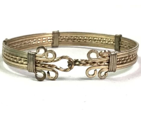 MEXICAN SILVER AND ENAMEL BRACELET, AND OTHERS comprising an eastern silver bracelet, tigers eye bracelet, rolled gold bangle