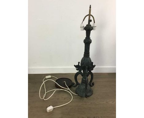 EAST ASIAN CAST METAL TABLE LAMP, cast in relief with symmetric designs, the base with triple stylised animal supports, on a 