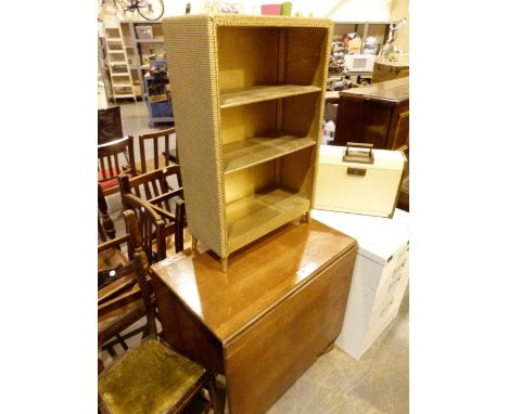 Vintage drop leaf dining table and a Lloyd loom style bookshelf 