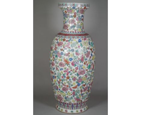 A Chinese famille-rose baluster vase, 20th century, printed and coloured with flowers beneath ruyi-head borders, 63cm. high, 