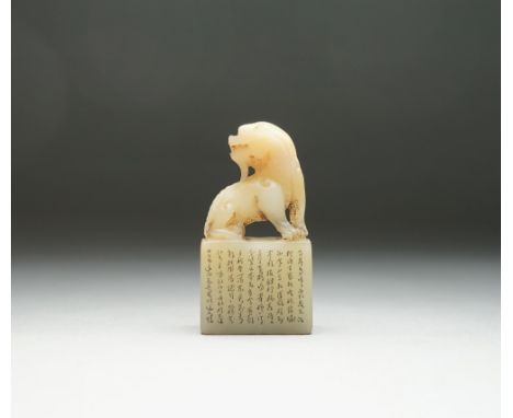 A small Chinese soapstone seal, Qing dynasty, the front incised with lines of calligraphy, surmounted by mythical creature, s