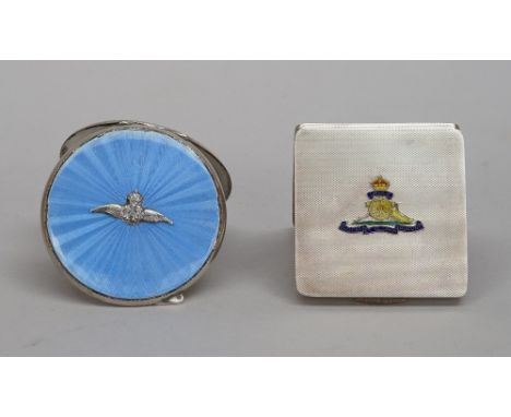A silver and enamelled lady's square powder compact, fitted with a mirror within, the lid enamelled with the badge of The Roy