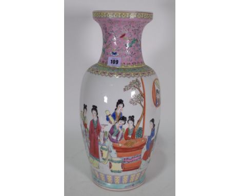 A Chinese famille-rose baluster vase, painted with young women at leisure, the reverse with lines of calligraphy, the neck en