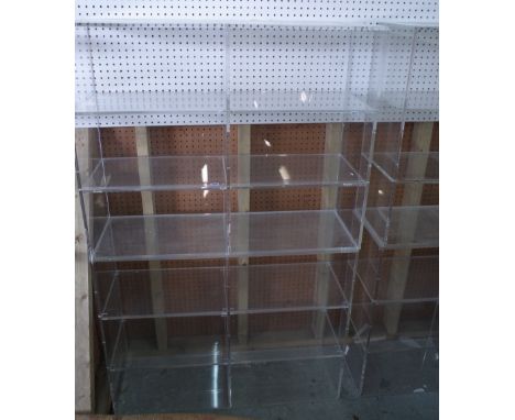 A pair of 20th century perspex three tier open bookcases, 101cm wide x 81cm high, (2).  Provenance; property from the late Si