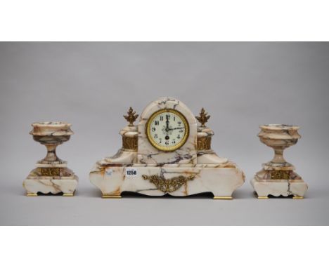 A French marble and gilt metal mounted marble clock garniture, late 19th century, of domed Art Deco form with relief cast fig