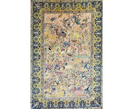 A fine Tabriz hunting carpet, Persian, the pale dull pink field with a landscape filled with horseman hunting a variety of wi