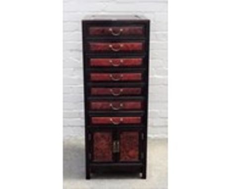 An early 20th century Chinese hardwood and burr wood bank of seven drawers over cupboards, pre-1918, 43cm wide x 113cm high. 