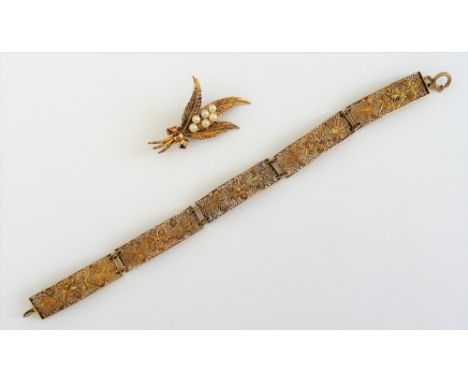 A gold and cultured pearl brooch, designed as a spray of heather, detailed 9 CT, gross weight 4.3 gms, with a case and a gilt