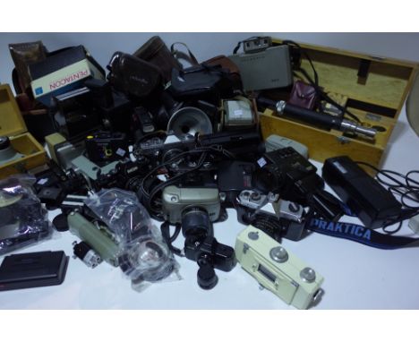 A large quantity of cameras, including Poleroid, Kodak, Minolta, Pentax, lenses and accessories, (qty). Sold as seen. 