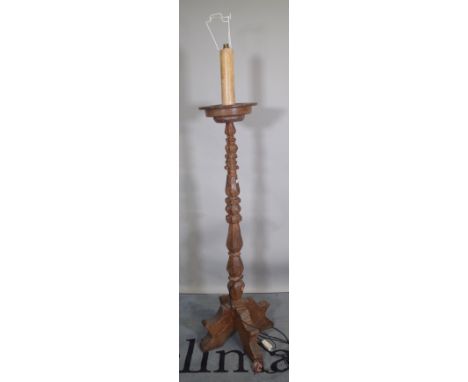 A 17th century Italian style carved walnut standard lamp, 129cm high excluding fitment.  