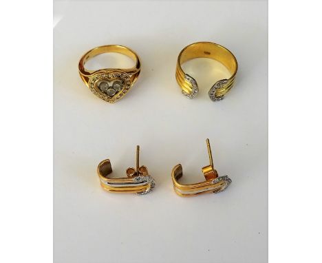 A gold and diamond ring, in a heart shaped design, between split shoulders, detailed 750 18 K and a gold and diamond set ring