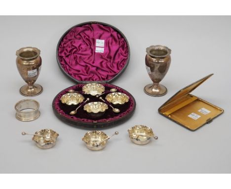 Silver, comprising; a set of four small shaped circular salts, with a set of four matching salt spoons, Birmingham 1887, case