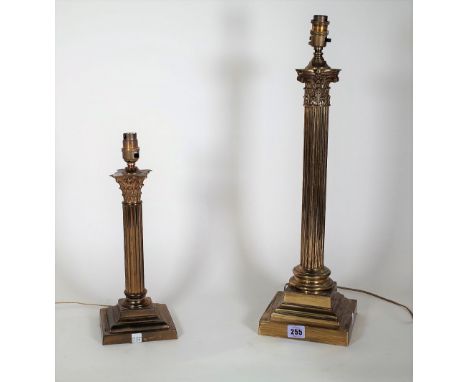 A 20th century brass table lamp formed as a Corinthian column on plinth base, 48cm high, and another smaller, 30cm high, (2).