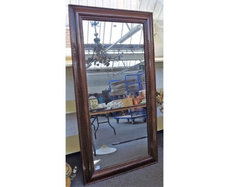 A 19th century Continental rosewood framed rectangular mirror, with split bobbin mounts, 101cm wide x 189cm high. 