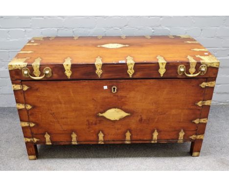 A 19th century Indian brass bound rectangular trunk, on block feet, 107cm wide x 64cm high. 
