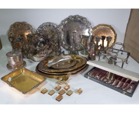 Assorted silver plated wares including; a table clock with French 8 day movement, pair of Louis XVI style candlesticks, eight