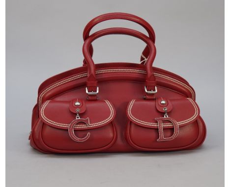 A Christian Dior red calf leather detective bag with two top handles and two exterior buckle front pockets with double white 